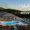 Aerial photo of the property with the outdoor pool and mountains in the background.